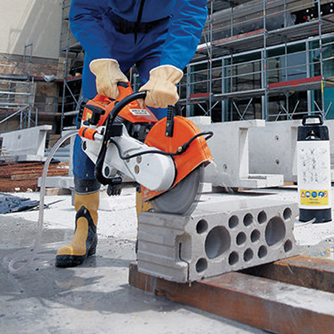 STIHL cut off saw cutting a concrete block